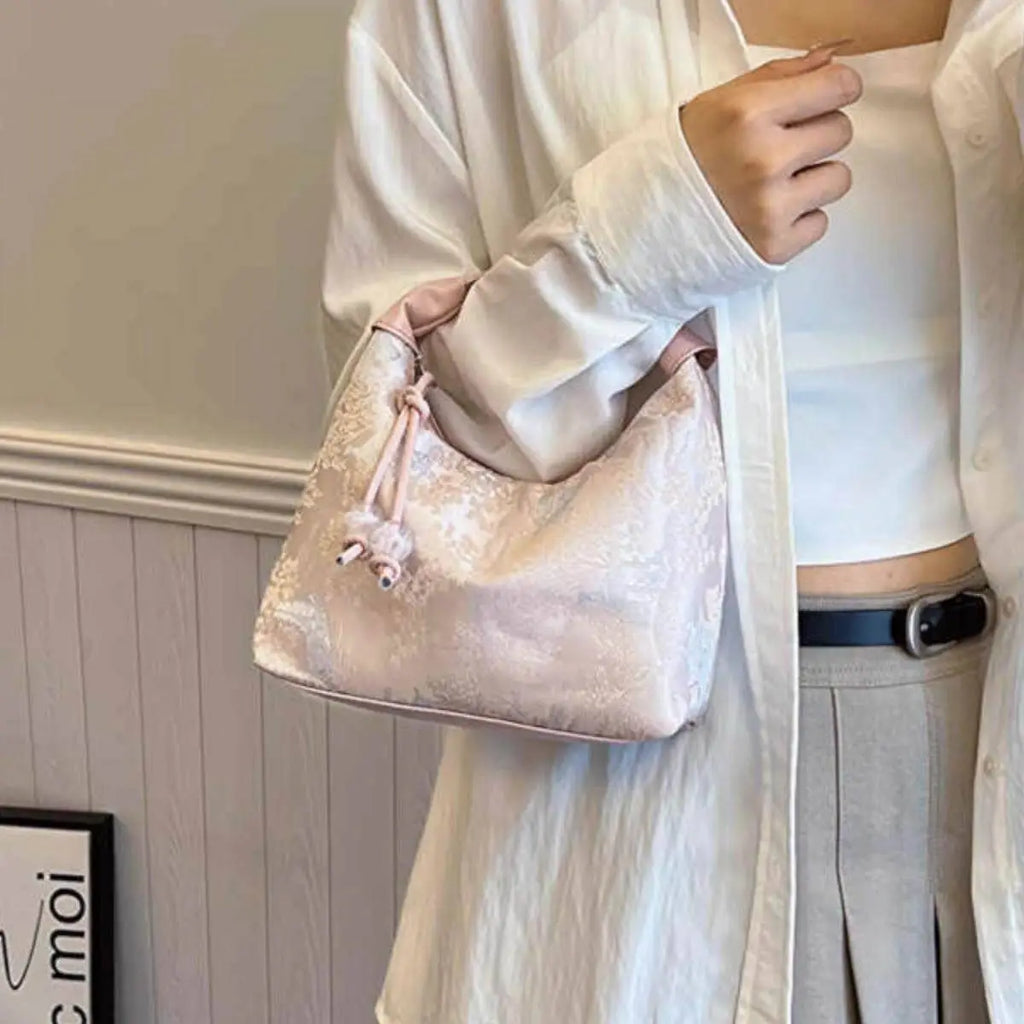 Pink Song Brocade Dumpling Bag with Embroidered Ball Charm – A Symbol of Wealth and Good Fortune