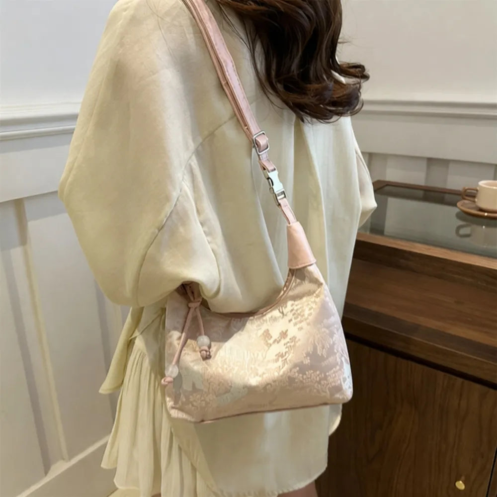 Pink Song Brocade Dumpling Bag with Embroidered Ball Charm – A Symbol of Wealth and Good Fortune