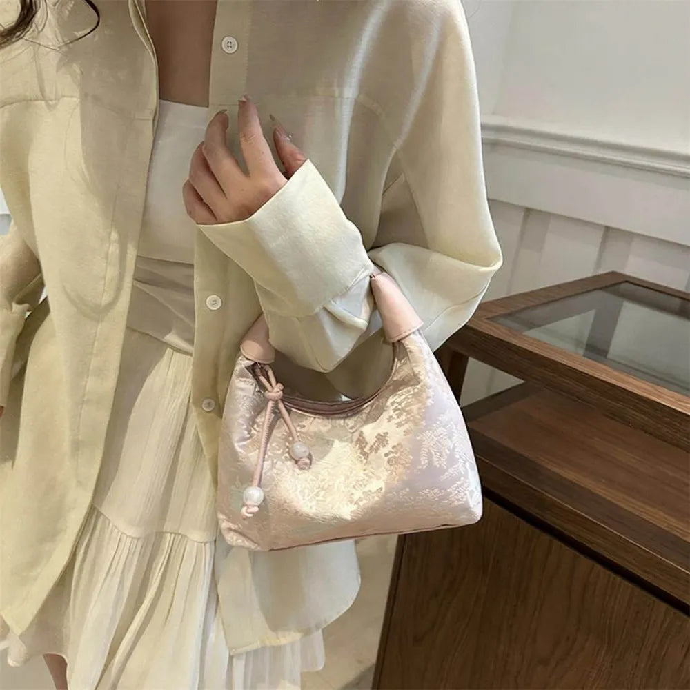 Pink Song Brocade Dumpling Bag with Embroidered Ball Charm – A Symbol of Wealth and Good Fortune