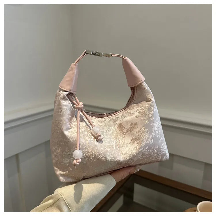 Pink Song Brocade Dumpling Bag with Embroidered Ball Charm – A Symbol of Wealth and Good Fortune